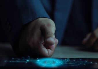 Businessman's fist over a futuristic fingerprint scanner with an AI brain icon. Concept of biometric authentication, cybersecurity, digital identity, and powerful business control.