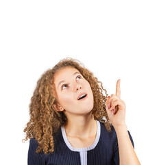 Positively surprised teenage girl with curly hairstyle, pointing forefinger as looks up astonished with mouth open. Frizzy ginger woman adolescent isolated on transparent background