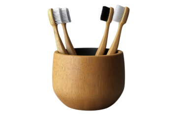 Eco friendly bamboo toothbrushes in a wooden holder promote sustainable oral hygiene practices at home on transparent background