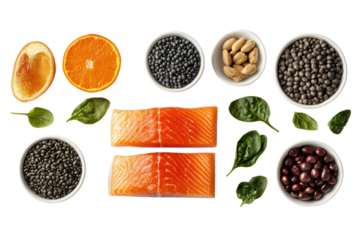 Healthy food arrangement featuring salmon orange lentils spinach pistachios and beans on transparent background