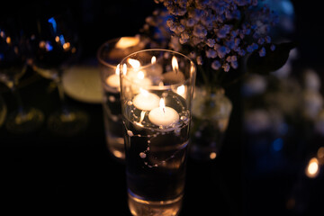 glass of water whit candle