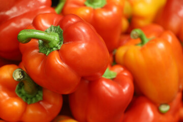 Sweet pepper close up. Red bell peppers on a market, paprika, vegetable background