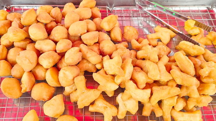 Deep Fried Chinese Bun fry and Chinese doughnut. Dough is fried in hot oil until crispy and golden brown. Bread fried bun recipe, crispy on the outside, soft on inside, popularly eaten with coffee
