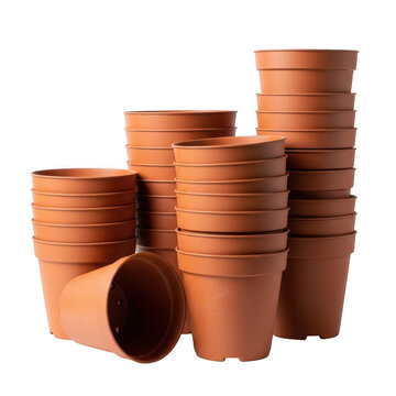 Stacked terracotta plastic plant pots on background flower garden