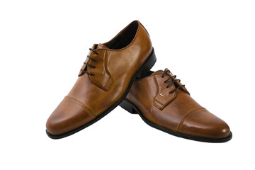 Elegant brown leather dress shoes crossed stylishly, creating a refined and polished fashion look.