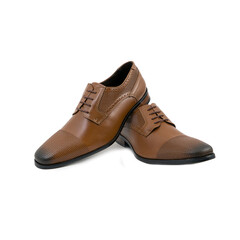 Pair of brown perforated leather dress shoes crossing gracefully, creating a refined polished formal mood.