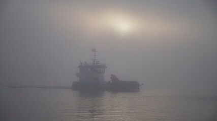 a ship in the fog at sea