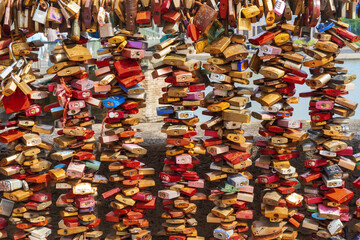 Many padlocks (wedding locks) hanging on the bridge over the Rhine in Cologne.