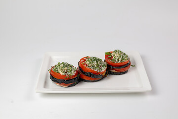 Elegant eggplant tomato stacks with herbs and cheese
