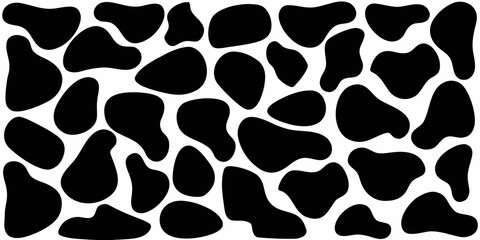 Abstract black and white cow print pattern with irregular shapes and organic blobs