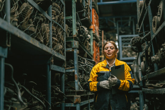 portrait technician women worker working in heavy industry, looking camera happy smiling