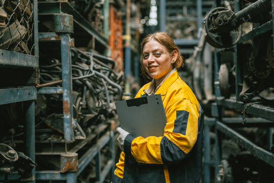 portrait technician women worker working in heavy industry, looking camera happy smiling - Powered by Adobe