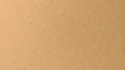 Old Kraft paper texture box craft stripes pattern. top view.
Abstract brown recycled paper background. 