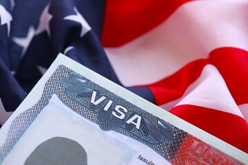 United States visa and US flag. Concept of Immigration and Travel to the United States