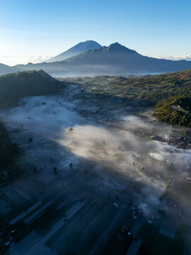 Drone view of sunrise over Mt Batur view from Pinggan village in Kintamani Bali Indonesia