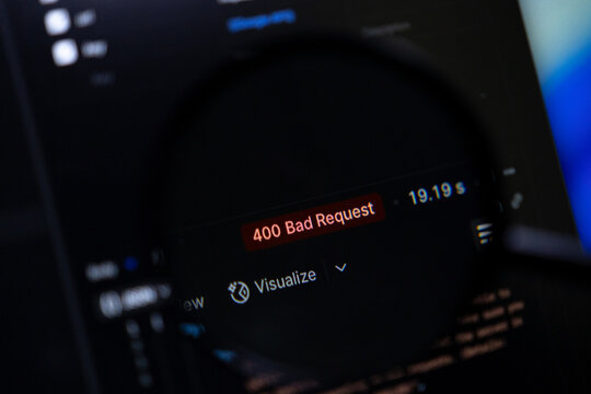 Magnifying glass highlights 400 Bad Request error on dark computer screen, symbolizing web development debugging, network issues, and IT system troubleshooting - Powered by Adobe