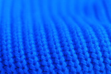 The blue knit sweater has a very soft and fuzzy texture