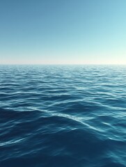 Obraz premium The vast expanse of the ocean stretches towards the horizon under a clear blue sky offe a sense of peace and tranquility to observers.
