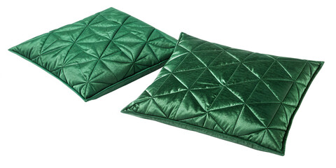 Two emerald green quilted throw pillows on black background cushion jewel tone