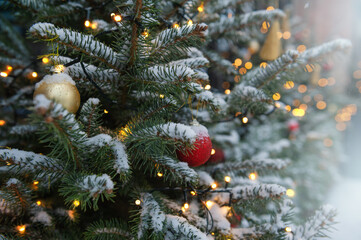 Festive pine tree decoration captured with a cozy, bokeh-filled background.