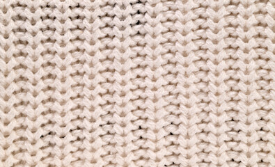 A close up of a knitted fabric with a white background