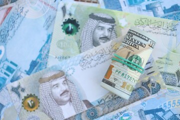 Bahraini dinar currency money bills and bunch of us dollars. The concept of currency exchange