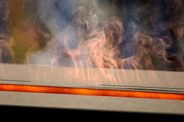 Modern Bioethanol Fireplace with Warm, Orange Flames and Smoke