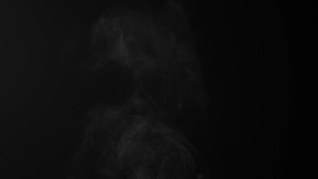 Steam, smoke, vapor isolated on black background. Smoke steam spray, abstract vaporing water, texture of cold mist, hot vapor, fog effect closeup, black screen. Hot food, drink. Slow motion. Overlay	