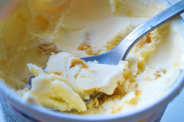 Ice Cream in a Container with Spoon