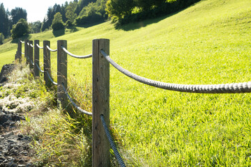 Rustic Wooden Fence in Alpine Countryside Landscape