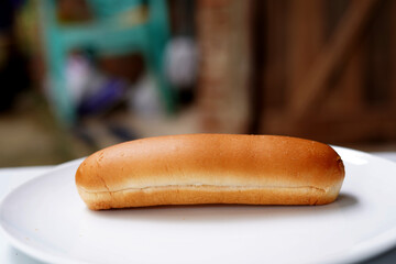Hot dog on a white plate