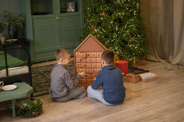 Children open the Advent calendar box on the last day of December on New Year's Eve. A pleasant surprise in anticipation of the winter holidays