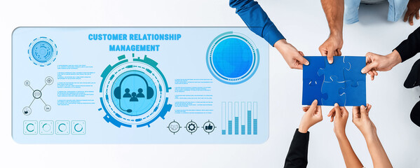 Diverse professionals engage in collaborative customer relationship management, analyzing digital data visualizations and strategizing solutions for enhanced client engagement. Trope