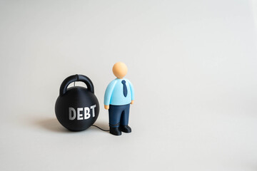 An office worker and the weight of debt. The debt trap prevents one from escaping poverty. Concept of financial pressure, economic inequality, banking loans, and credit dependency.
