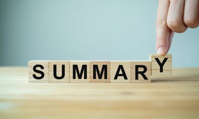 Summary in Focus: A hand places the final block to complete the word Summary, symbolizing completion, clarity, and the essence of concise information.