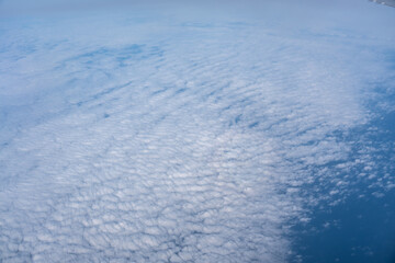 Obraz premium Blue sky with white clouds, flying above cloudy sky texture pattern, cloudscape blurred light