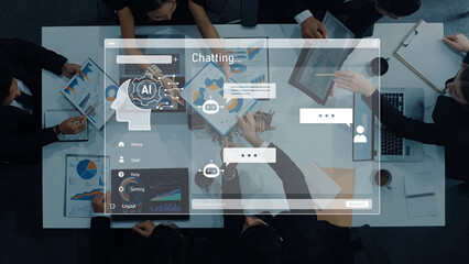 A top-down view of professionals engaged in a business meeting, discussing data analysis and collaborating on an innovative AI chat interface in an office setting. Trope