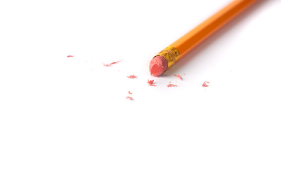 Eraser on paper. Erasing what was written, deleting an error, correcting mistake