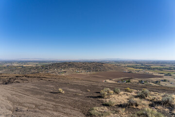 South Menan Butte. North Menan Butte Trail, tuff cones - volcanoes. Madison County, Idaho. Snake River Plain. Tuff  made of volcanic ash ejected from a vent during a volcanic eruption.  
