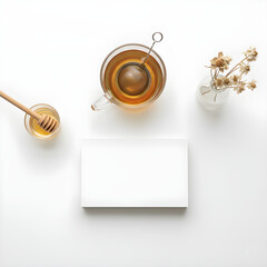 Minimalist Flat Lay with Blank Card Mockup, Herbal Tea, and Honey on White Background