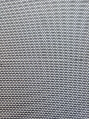 Close-up view of woven fabric showing intricate patterns and textures