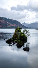 Rocky outcrop, lake reflection