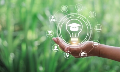 Knowledge at Your Fingertips: A hand delicately cradles an illuminated idea, showcasing the essence of education and learning amid a backdrop of vibrant greenery.