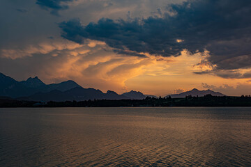 Beautiful sunset by the lake Forggensee in Füssen, Bavaria in Germany

