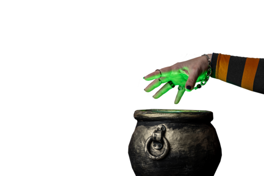 Witch's hand over a cauldron with a magic potion on isolated background. Witch witchcrafting, casting spells on Halloween night