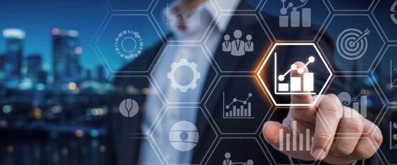 Data Driven Insights: A sharp, focused individual interacts with an illuminated interface displaying statistical charts and other business analytics symbols.