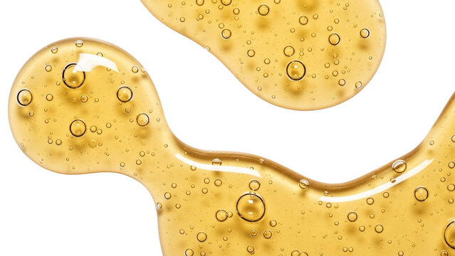 Drops yellow transparent cosmetic gel or serum with bubbles texture background. Liquid hyaluronic acid emulsion swatch on transparent background.