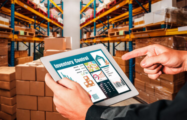 Warehouse management innovative software in computer for real time monitoring of goods package delivery . Computer screen showing smart inventory dashboard for storage and supply chain distribution .