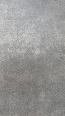 Fototapeta premium Gray textured surface showing subtle patterns suitable for various artistic and architectural uses