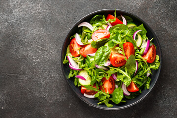 Fresh salad with leaves and vegetables.